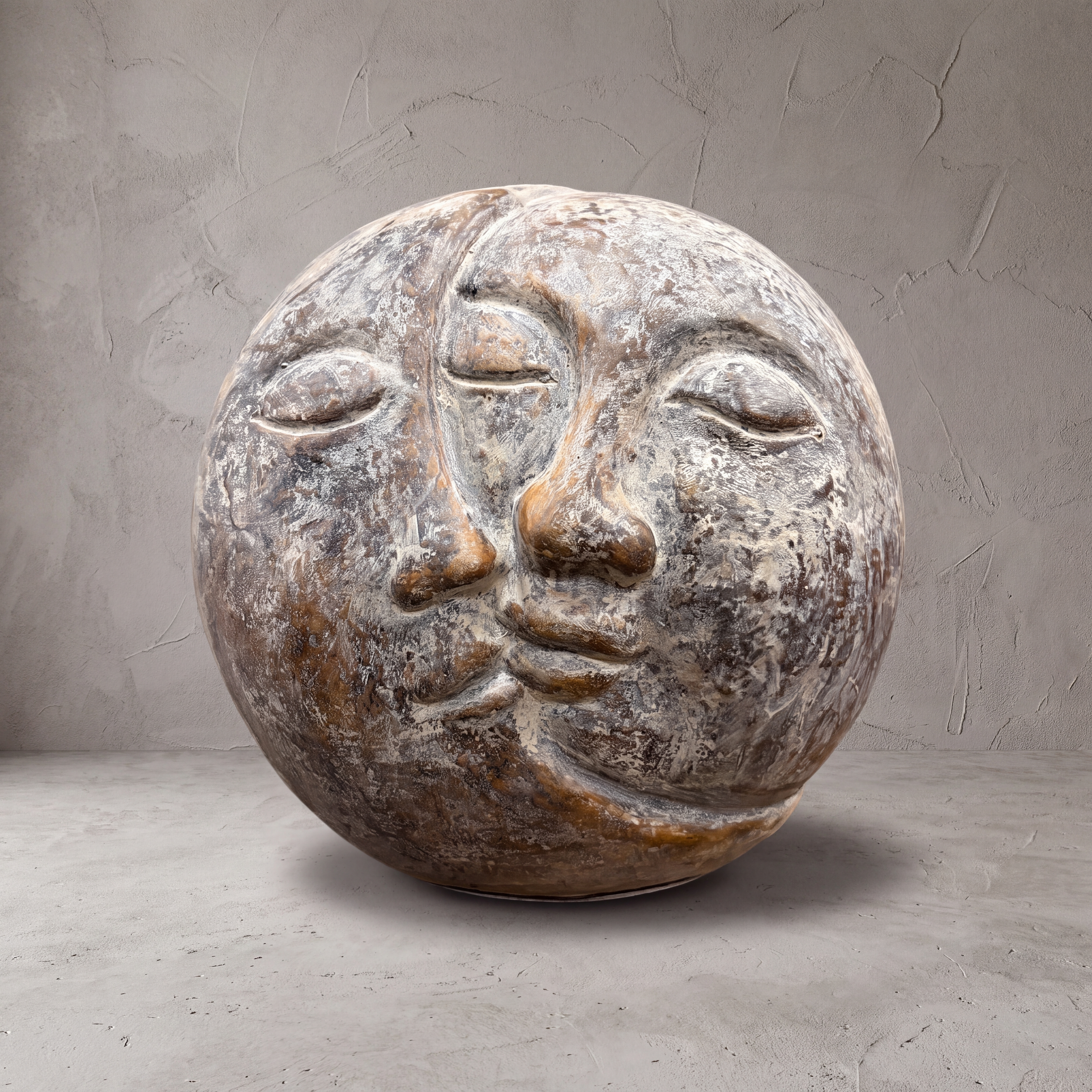 Moon polystone sculpture, two faces, 40 cm long