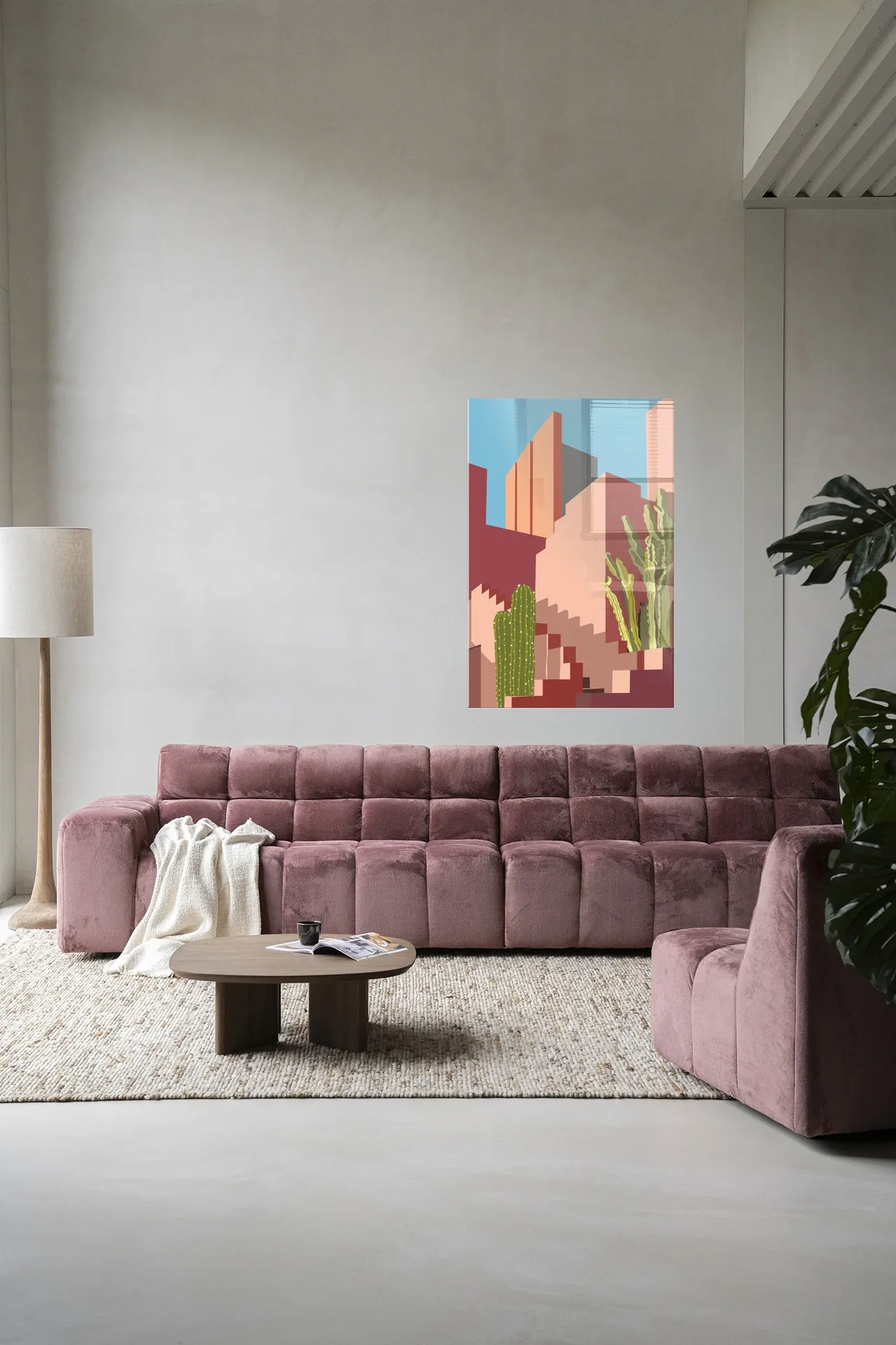 Wandkleed Botanical Stairs - Urban Cotton hangend boven een roze bank in een moderne woonkamer