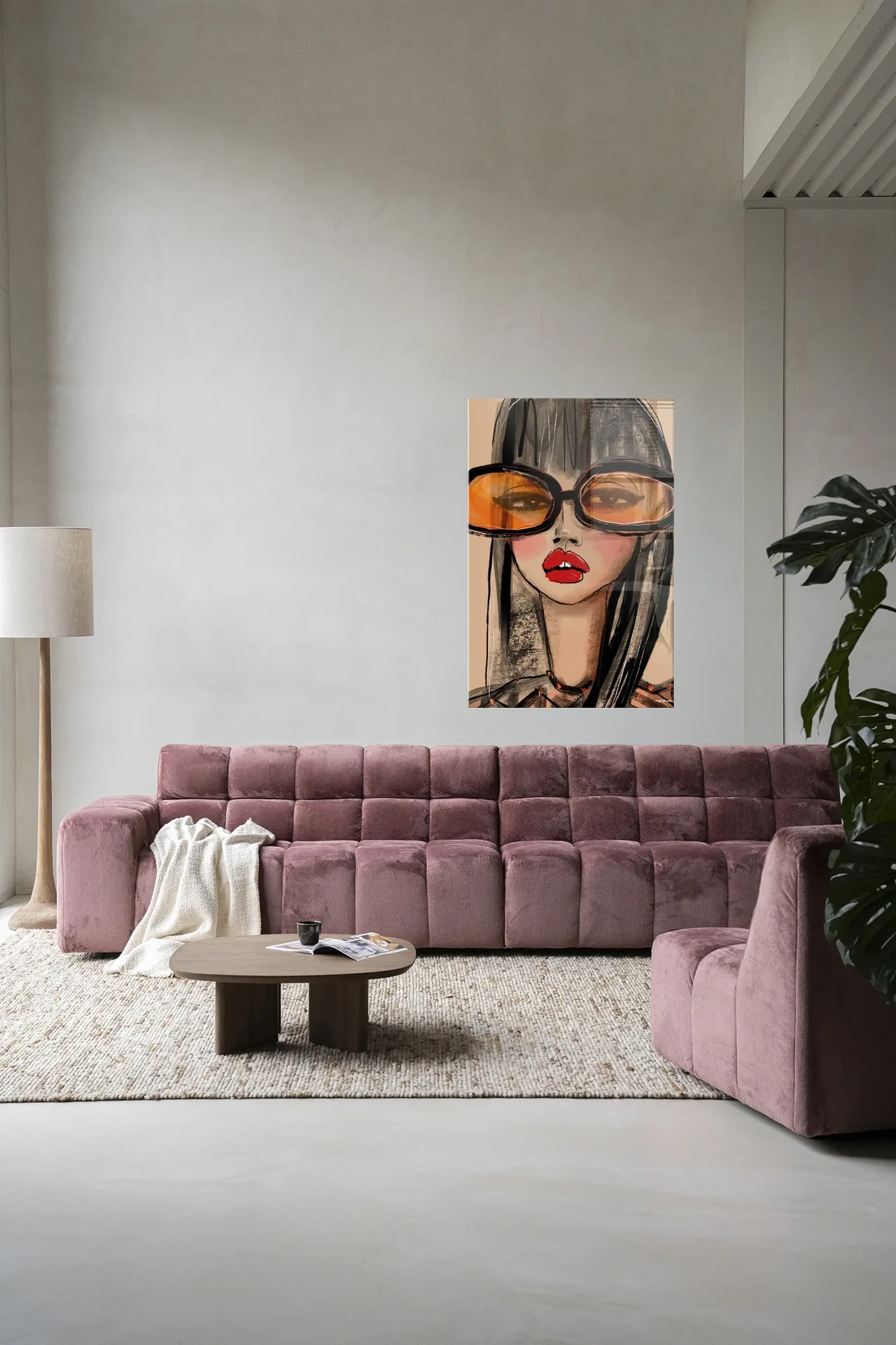 Wandkleed Sunny Orange - Urban Cotton hangend boven een roze bank in een moderne woonkamer
