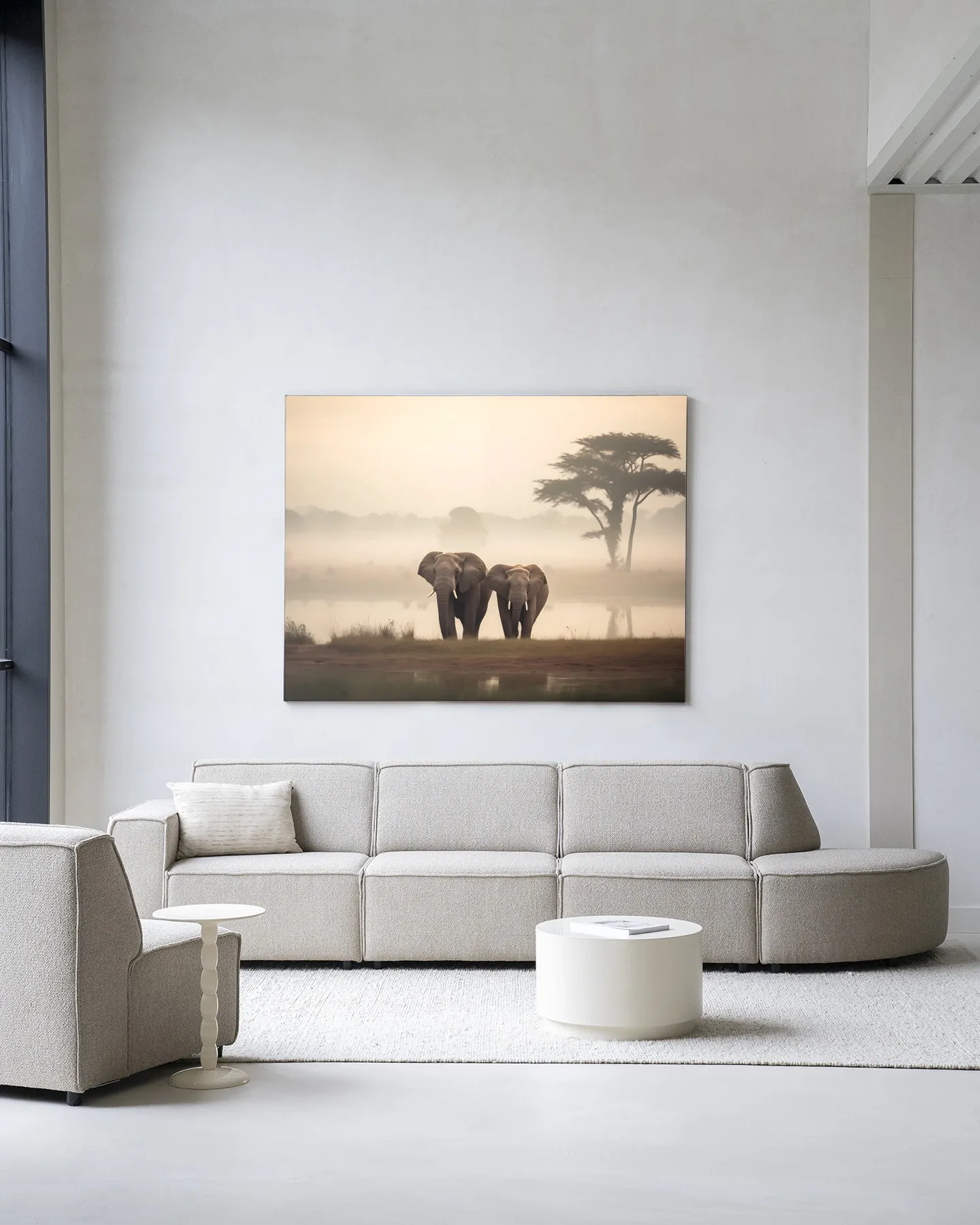 Wandteppich Elephant Mother - Urban Cotton in einem modernen Wohnzimmer über einem hellgrauen Sofa