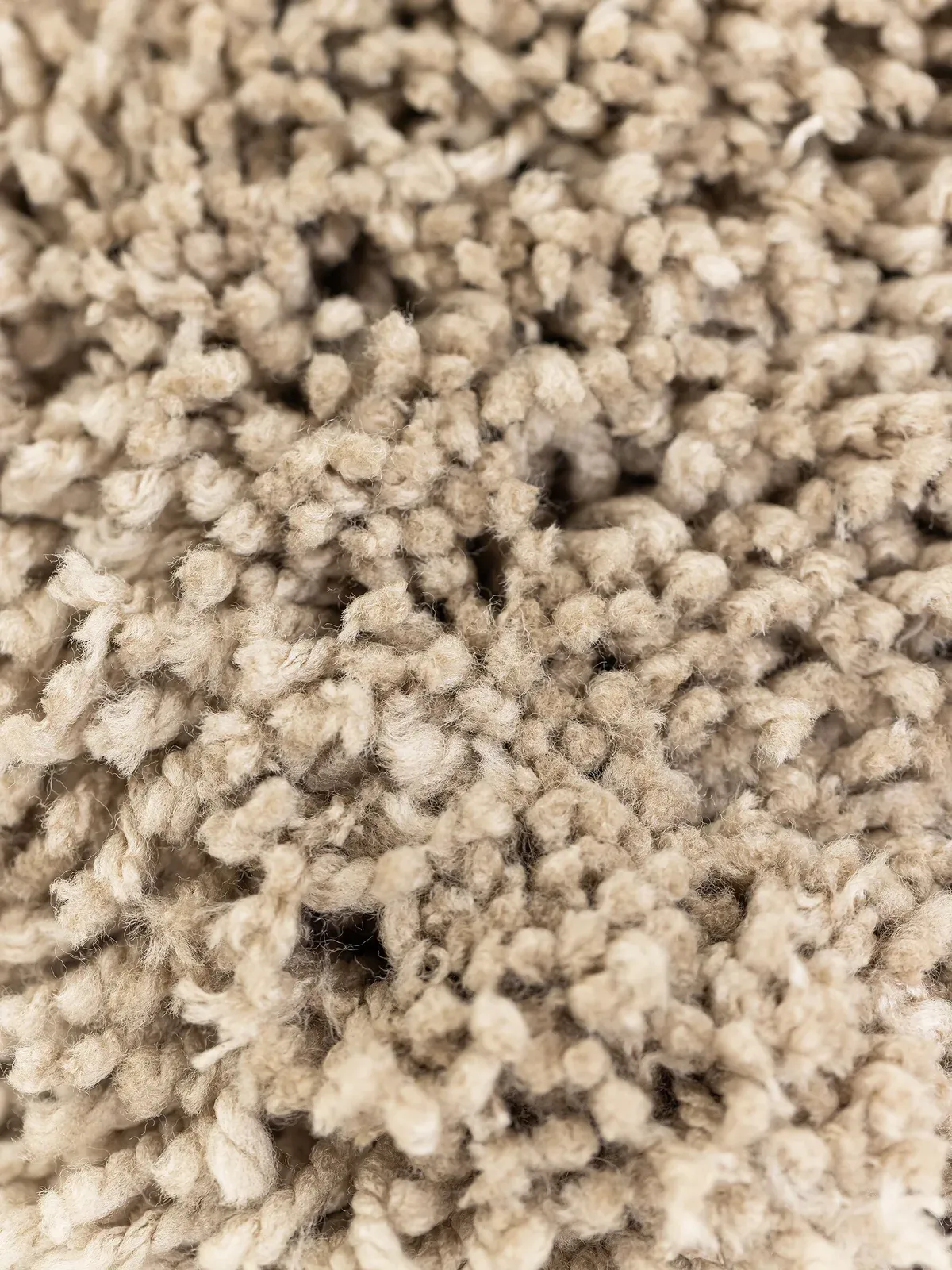 Detailaufnahme des Pouf Celeste 2, mit der Struktur des beigefarbenen Stoffes - MUST Living