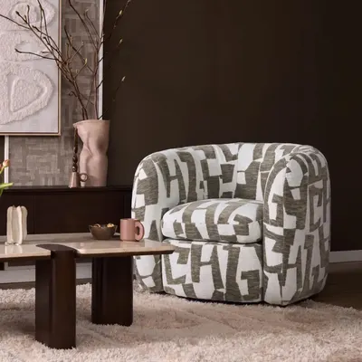 Fauteuil Rosa Groen heeft een zachte bekleding met een opvallend grafisch patroon in groen en lichte tinten.
