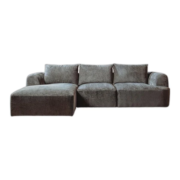 Das Canterbury 2 5-AR + Chaise L - Mona 464 Cement Grey Sofa in einer stimmungsvollen Studio-Umgebung mit hellen Wänden und Holzregalen - Tower Living - Mona 464 Cement Grey