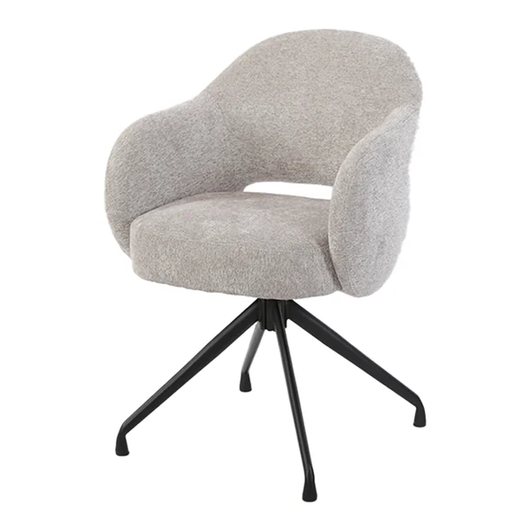 De Porto Armstoel - Toro 25 sand (draaibaar) staat in een landelijke woonkamer met een donkere kast en een bijzettafel - Tower Living - Toro 35 beige