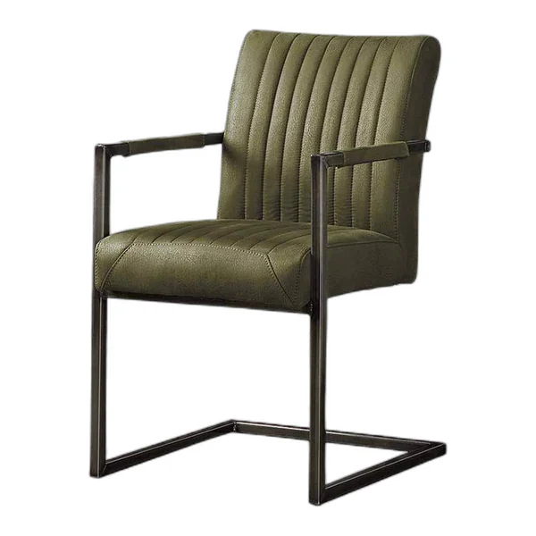 De Ferro Armstoel - fabric Savannah anthracite staat in een sfeervolle woonkamer met houten wanden en een betonnen vloer - Tower Living - Savannah green