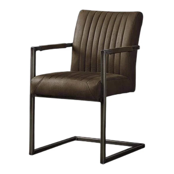 De Ferro Armstoel - fabric Savannah anthracite staat in een sfeervolle woonkamer met houten wanden en een betonnen vloer - Tower Living - Savannah dark brown