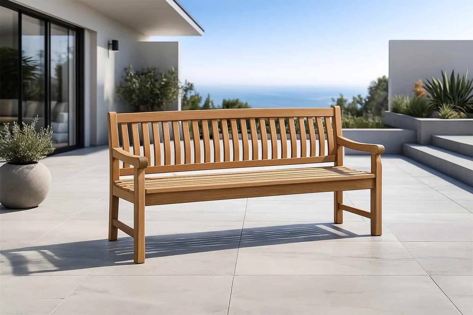 Gartenbank Patrick 5 cm 200 cm auf einer Terrasse mit Meerblick und einem Pflanzgefäß - Livingfurn