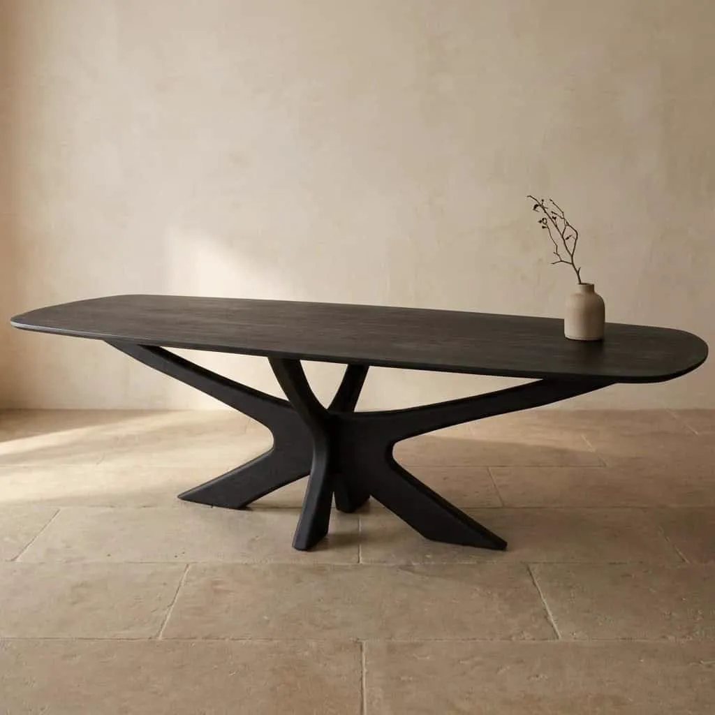 Esstisch Brix Montreaux Black 250cm in einer Studio-Umgebung mit einer Vase und einem Zweig